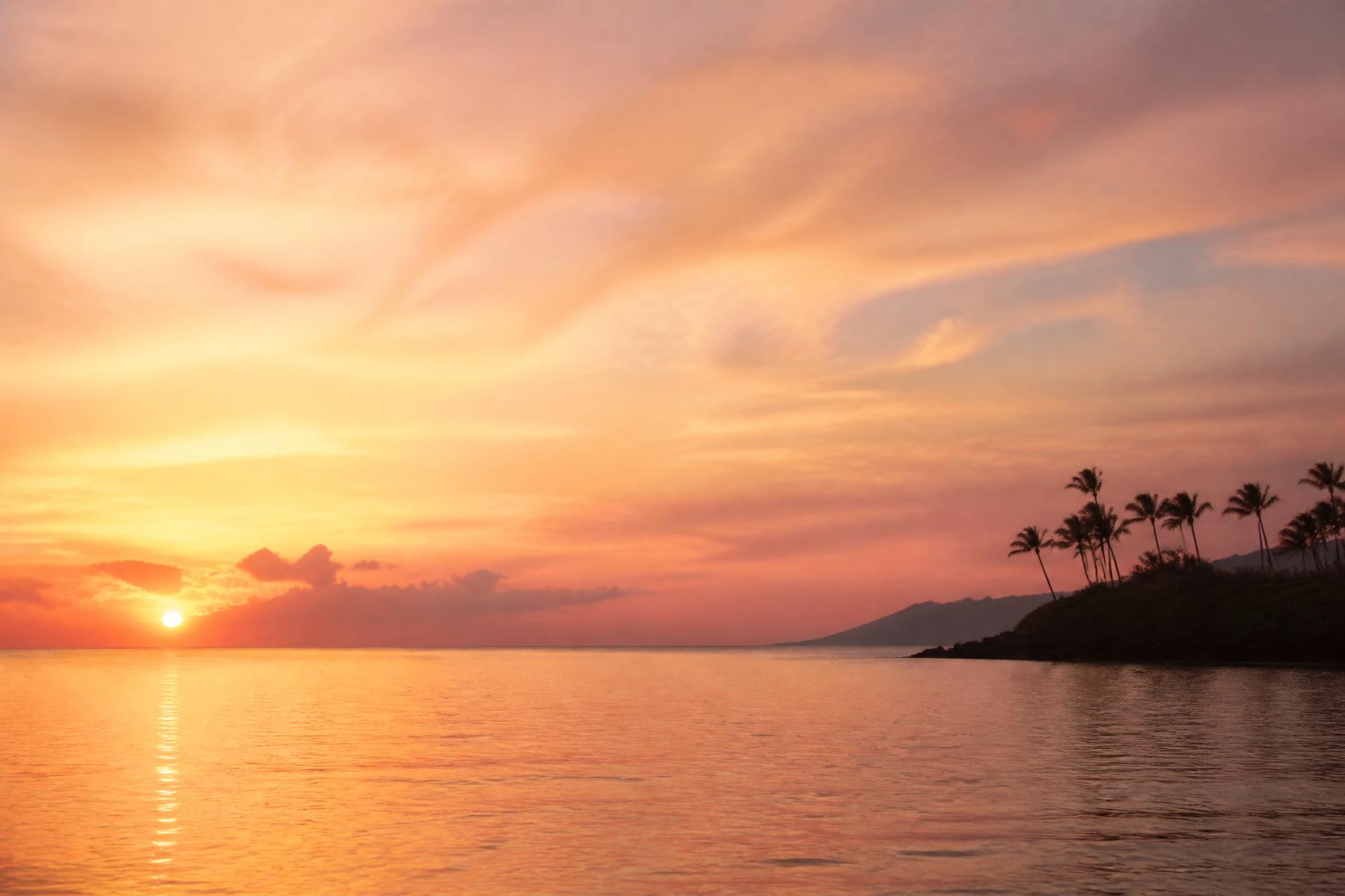 A soft Hawaiian sunset over a calm ocean